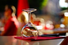 clear wine glass on top of brown table