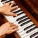 close up photo of person playing piano